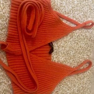 I am selling a orange in front tie up croptop,it is from shein.
